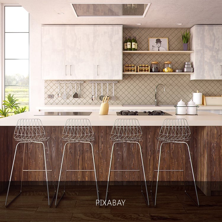 4 barstool in a bar slash kitchen with wooden panelings in a luxury home | Luxury homes by brittany corporation