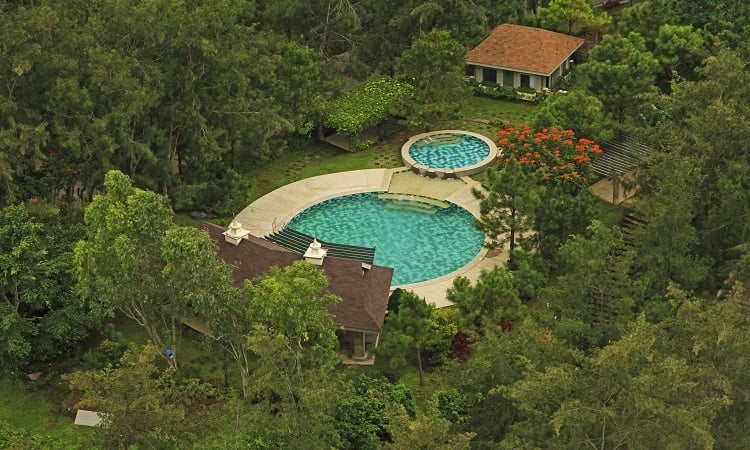 A swimming pool right in the middle of luscious greenery in Crosswinds Tagaytay's development of luxury houses | Luxury Homes by Brittany Corporation
