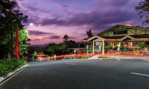 A long exposure shot of Crosswinds Drive with the retail row and Pine Cone Trail in sight at Crosswinds Tagaytay | Luxury Homes by Brittany Corporation