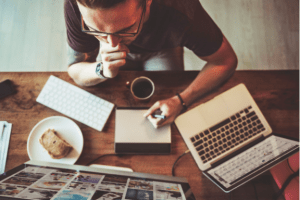 Working professional eating breakfast while using his laptop at home | Luxury house and lot | Luxury homes by Brittany