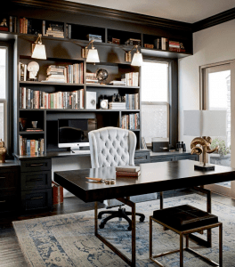 luxurious classy home office with white leather office chair and other modern-classic furniture with hints of gold, a grand wooden shelf at the back, on a traditional carpet | Luxury Homes by Brittany Corporation