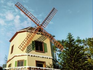 The iconic windmill overlooking the scenic view of pine trees and hills in Tagaytay, only found in Crosswinds | Luxury Homes by Brittany Corporation