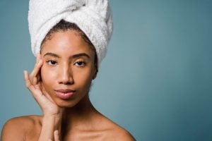 Woman wearing a towel wrapped around her head during a luxury home spa experience - Luxury homes by Brittany