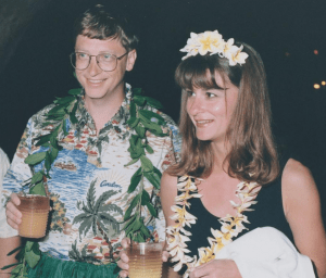 A young Bill and Melinda Gates in a Hawaiian-themed party, celebrating their high-profile marriage | Luxury Homes by Brittany Corporation