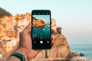 Taking a photo of rock formation on mobile phone - Luxury homes in the Philippines