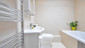 Sleak designed white themed bathroom of a luxury condo for sale in the Philippines | Brittany Corporation