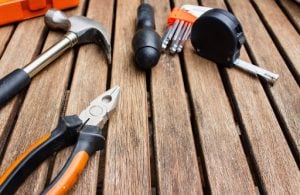 Steel measuring tape pliers and a hammer are some essential items one needs when mainting and caring for their luxury home | Brittany Corporation