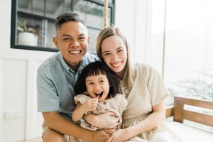 Happy Filipino family of mother father and daughter | luxury lifestyle and homes by Brittany Corporation