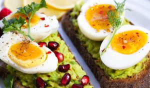 Avocado toast with egg and pomegranate in the kitchen of luxury house and lot for sale | Luxury Homes by Brittany Corproration