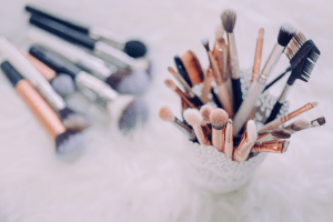 Different kinds of makeup brushes in a container | Luxury Homes by Brittany Corporation