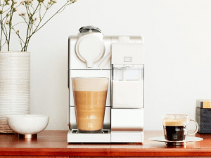 Simple clean modern coffee maker on a brown table | Luxury Homes by Brittany Corporation