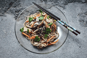 Healthy asian cuisine food noodles with chopsticks | luxury lifestyle and homes by brittany corporation