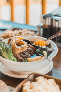 family size bowl of filipino food bulalo beef broth soup for cold weather in a luxury condominium development at tagaytay | luxury lifestyle and homes by brittany corporation