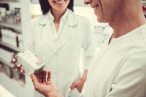 woman and man couple checking paraben-free products at the pharmacy | luxury homes by brittany corporation