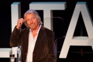 Sir Richard Branson speaking during a conference | luxury homes by brittany corporation