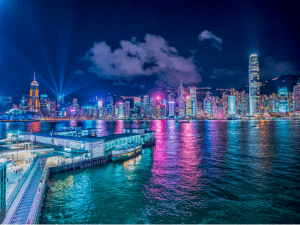 Photo of the bay area night scene with skyscrapers in one of the most visited cities to travel in Hong Kong - Brittany Corporation - Scenic Destinations around the world