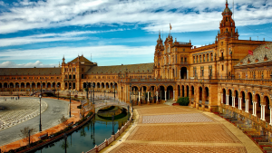 Spanish palace in the Mediterranean with colors of orange and blue perfect for retirement in europe | luxury homes by brittany corporation