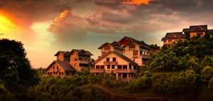 A row of luxury houses surrounded by trees and lighted by the sunset | luxury homes by brittany corporation