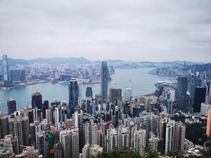 Hong Kong skyline overseeing the ocean luxury condos and luxury condominium in the background for vegan travel | luxury homes by brittany corporation