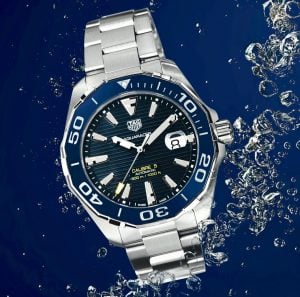 Silver and blue tag heuer watch aquarcer line under water with a blue background worn by prople that live in luxury condominiums in Crosswinds Tagaytay | luxury homes by brittany corporation