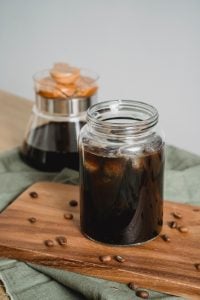Iced coffee in a glass mason jar | luxury homes by brittany corporation
