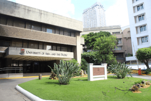 University of Asia and the Pacific facade luxury university with plants on the front lawn surrounded by buildings in Manila | Luxury homes by brittany corporation