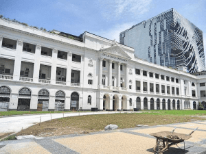 De La Salle University facade white building luxury architectural design and dead grass in front | Luxury homes by brittany corporation