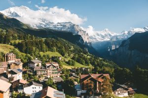 A town high in the mountains with mountain peaks in the background. | Luxury homes by brittany corporation