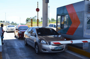 3 cars in line at the toll gate of mcx as they try to get home | Luxury Homes by Brittany Corporation