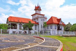 Aguinaldo shrine kawit cavite old spanish house with man using a bike cobblestone road | luxury homes by Brittany Corporation