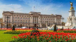 Buckingham palace most expensive homes luxury mansion with red and yellow tulips around it | Luxury homes by Brittany corporation | Luxury homes by Brittany corporation