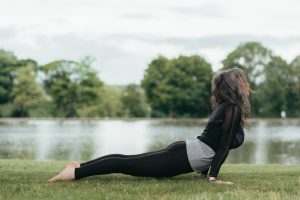 cobra yoga position outside the garden of a luxury house and lot | Luxury Homes by Brittany Corporation