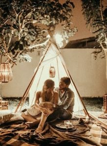 couple enjoying each others company in their luxury home in a tent | Luxury Homes by Brittany Corporation