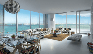 missoni baia miami luxury condominium overseeing the ocean glass table with food sofa anf curtains | Luxury homes by Brittany Corporation