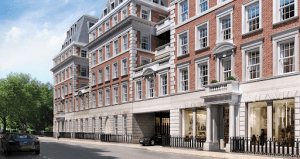 no 1 grosvenor square london luxury condominium red brick wall and stone brick wall black car below surrouded by trees | Luxury Homes by Brittany Corporation