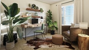 A photo of a white-themed home office, featuring a n olive green chair, wooden table, computer monitor, and some indoor plants | luxury homes by brittany corporation