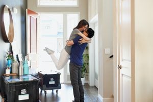 Photo of a couple hugging in the living room | luxury homes by brittany corporation