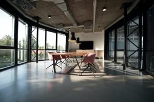 Photo of chairs and a long table inside a corporate boardroom. | luxury homes by brittany corporation