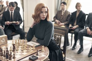 anya taylor joy wearing an all black ensamble playing a chess game in queens gambit | luxury homes by brittany corporation