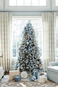 baby blue themed christmas tree with gifts around it | luxury homes by brittany corporation