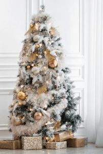 christmas tree designed with feathers and balls and gifts underneath | luxury homes by brittany corporation