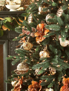 christmas tree inspired by the victorian era with flowers and balls | luxury homes by brittany corporation