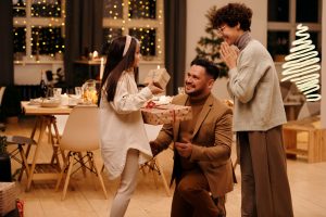 father giving his children gifts on christmas day | luxury homes by brittany corporation