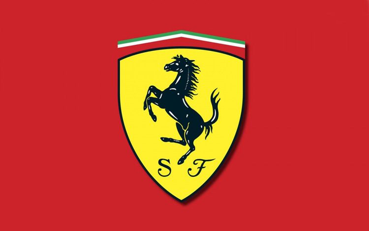 ferrari logo red background with yellow sheild with a black horse | luxury homes by brittany corporation