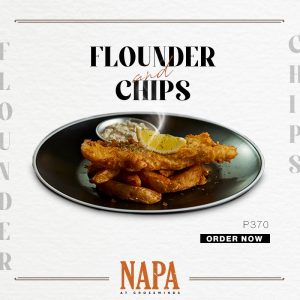 fish and chips at crosswinds napa fish on black plate with lemon | luxury homes by brittany corporation