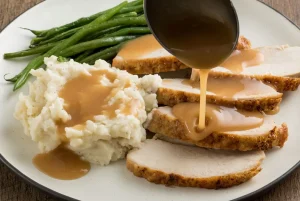 gravy boat with gravy mashed potatoes and turkey | luxury homes by brittany corporation