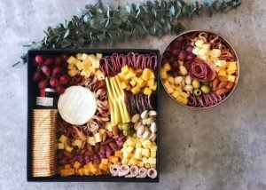 grazing box with cold cuts cheese and wine | luxury homes by brittany corporation