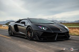 iconic italian car lamborghini aventador black on the streets | luxury homes by brittany corporation