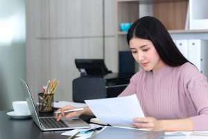 lifestyle-beautiful-asian-business-young-woman-using-laptop-computer-smart-phone-office-desk | Luxury homes by brittany corporation