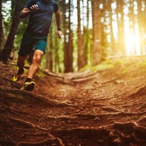 man jogging on off road trail | luxury homes by brittany corporation